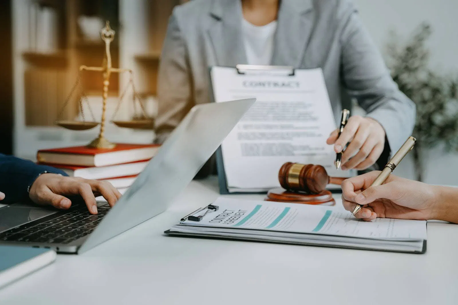 A lawyer and client have a serious discussion in a professional office.