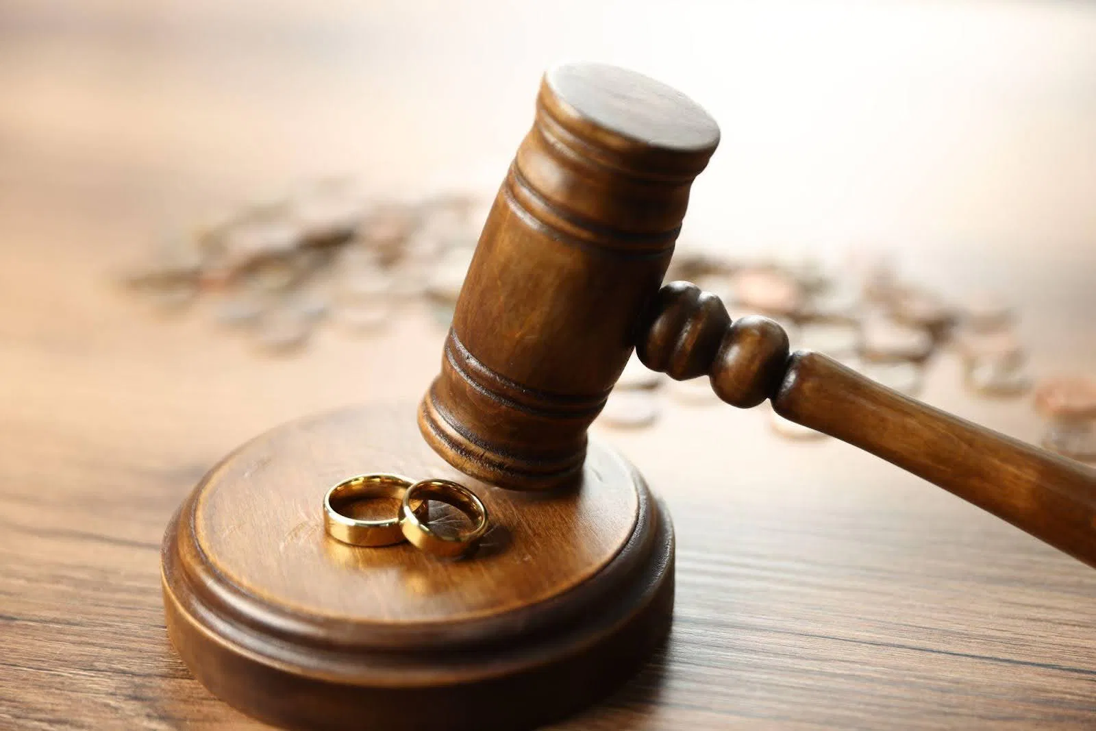 Wedding rings resting on a rustic wooden table symbolizing love and commitment