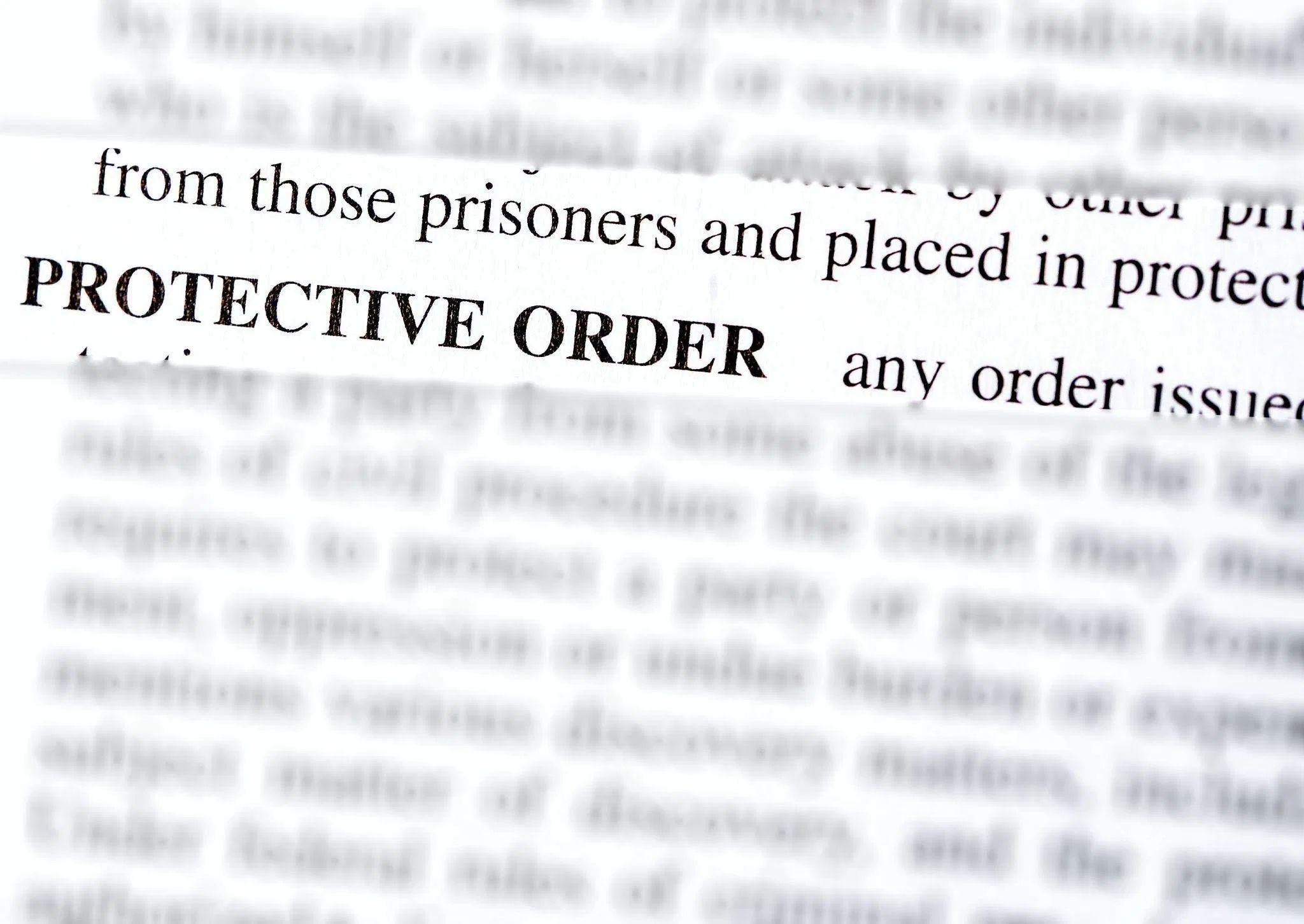Text highlighting Protective Order in bold letters surrounded by blurry document text